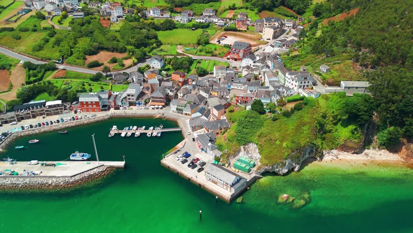 Aerial view of O Porto do Barqueiro, a picturesque fishing village and port in Manon, Ferrolterra, province of A Coruna, Galicia, Spain. Traditional coastal parish with maritime heritage.