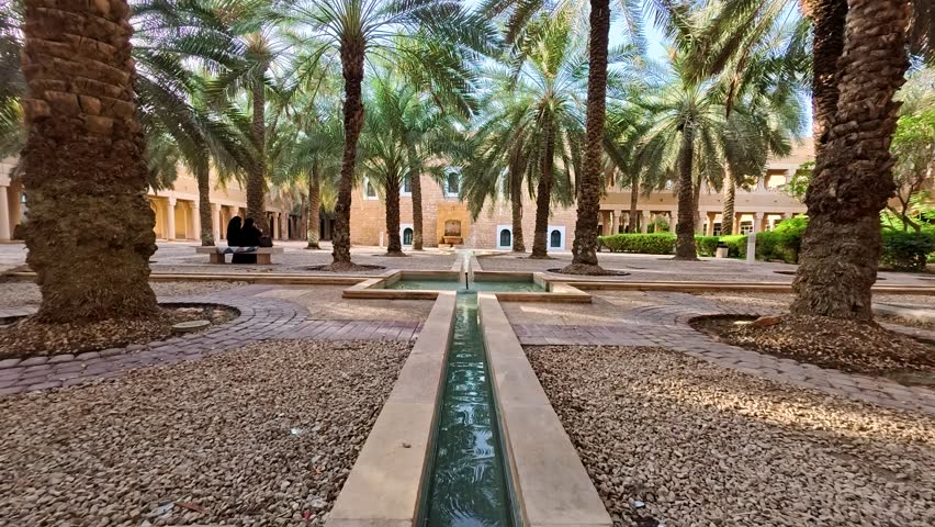 Riyadh, Saudi Arabia, 17.05.2025. Exterior of Al Murabba Historical Palace The Story of the Founding King s Palace in Riyadh. Walking area with a water fountain and many palm trees, old Arabic style.
