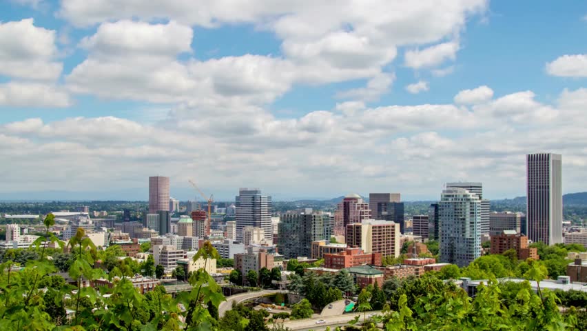 Panoramic view of the portland oregon skyline on a sunny day with blue sky