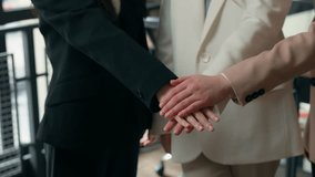 Three happy candid business women success teamwork in office stacking hands multiracial colleagues multiethnic businesswomen girls females partnership corporate celebrating Caucasian Asian ladies - Powered by Shutterstock - Get 15% off with code: PIKWIZARD15