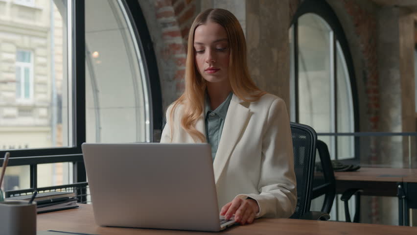 Caucasian talking concentrated businesswoman girl female business woman entrepreneur professional in office working communicate video call job conference with laptop writing notes ideas information - Powered by Shutterstock - Get 15% off with code: PIKWIZARD15