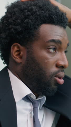 Close up stressed anxiety worried depressed African American business man thinking problem solution looking at window in office trouble pondering difficult decision businessman male working stress