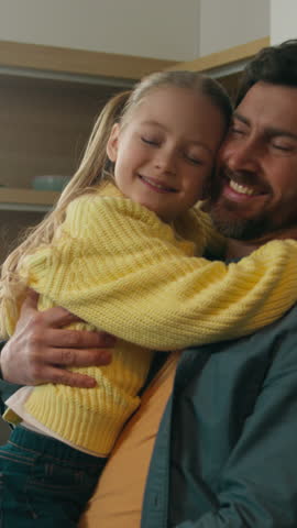 Happy affectionate Caucasian family in kitchen home father man dad with kid daughter cuddling hugging holding child girl talking carefree devotion parenting good fatherhood bonding insurance concept