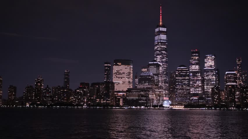 New York City skyline with illuminated One World Trade Center at night