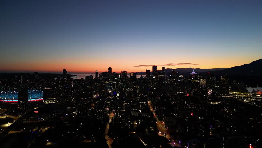 Sunset over Vancouver skyline in summer drone aerial