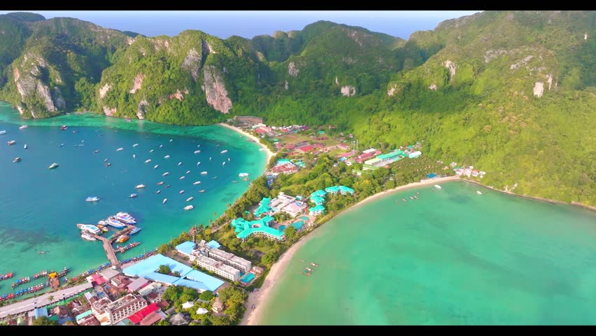 Experience the stunning beauty of Koh Phi Phi Island in Thailand through mesmerizing flycam footage capturing the true essence of this tropical paradise.