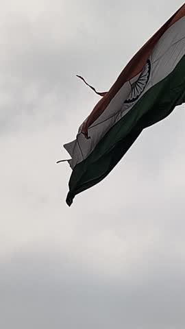 A torn tricolor flag is flying in the country