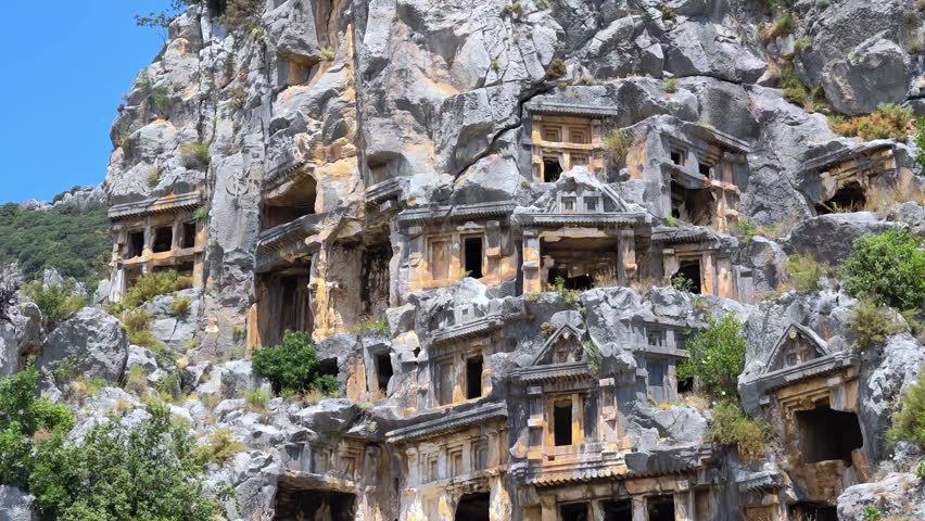 Rock-cut tombs of the ancient Lycian necropolis. Myra is an antique town in Lycia where the small town of Kale (Demre) Turkey. Close-up of rock cut tomb grave.