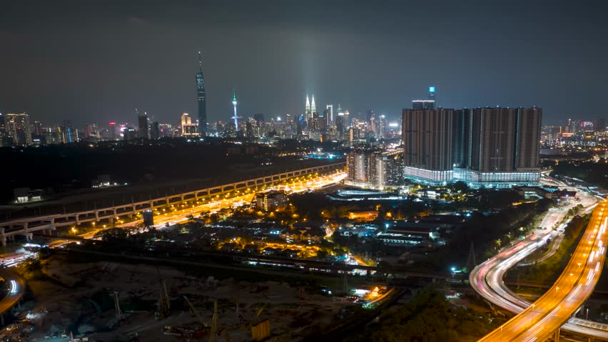 4k aerial time lapse of night scene at Kuala Lumpur city center. Pan right