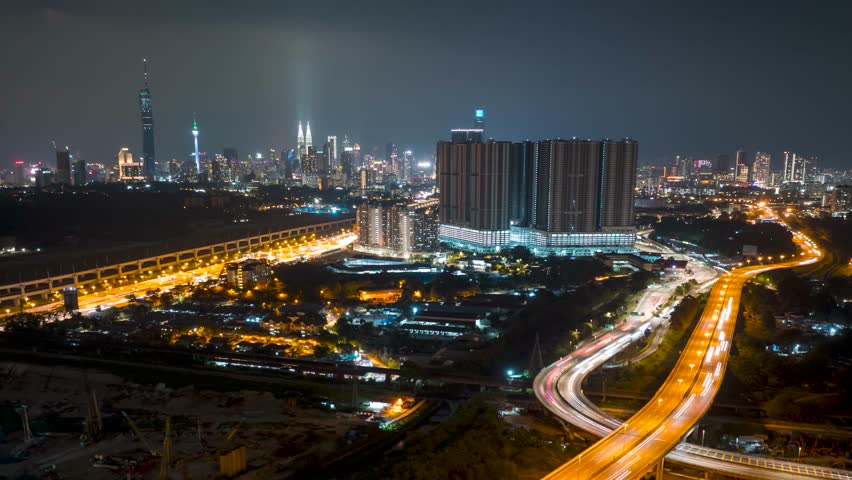 4k aerial time lapse of night scene at Kuala Lumpur city center. Zoom out