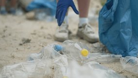 Volunteers cleaning rubbish to protect environment. Family teamwork removing trash from nature. Environmental action by family to preserve nature. Family volunteers help clean environment from rubbish - Powered by Shutterstock - Get 15% off with code: PIKWIZARD15