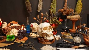 Human skull on black, selective focus, surrounded by magic esoteric ritual tools and items. Occult magic study and knowledge. Mysticism supernatural science. Wicca occultism and witchcraft. - Powered by Shutterstock - Get 15% off with code: PIKWIZARD15