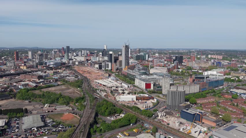 Aerial panoramic skyline of Birmingham cityscape with the new HS2 rail line under construction and the site of the new Birmingham Cursor Street train station providing fast rail journey