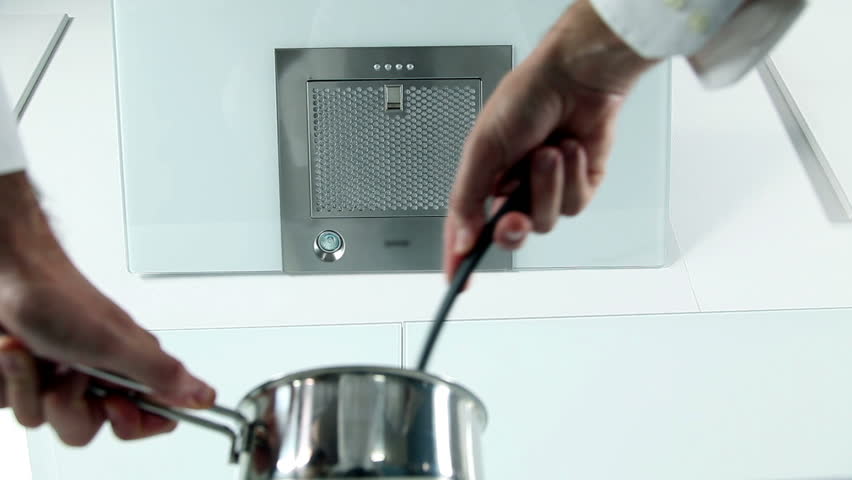 Man preparing meal for family in a sterile kitchen