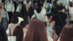 Bangkok Crowded urban walkway showcasing diverse pedestrians moving through a bustling mall environment. Focus on individuals from various angles demonstrating lively foot traffic. High-energy - Powered by Shutterstock - Get 15% off with code: PIKWIZARD15