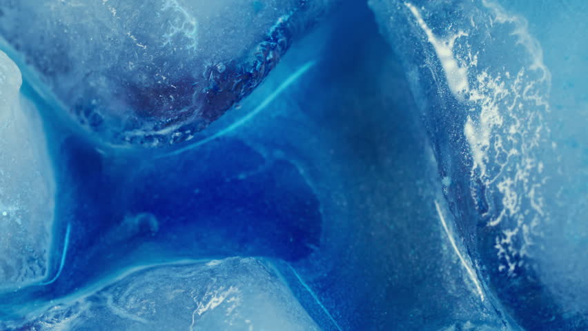 Melting water. Ice texture. Defocused blue color shiny ink flowing drop floating on abstract creative frost light art background.