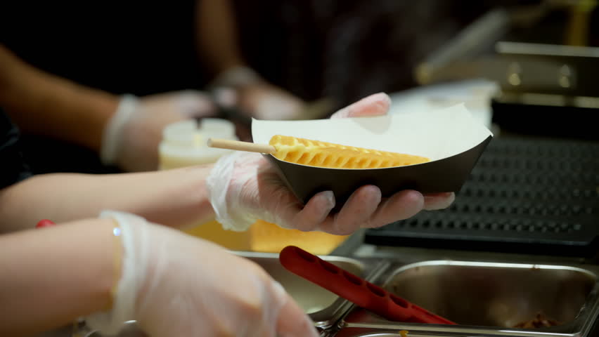 Pouring Batter on Hot Waffle Iron on event. Professional Waffle Machine in Action