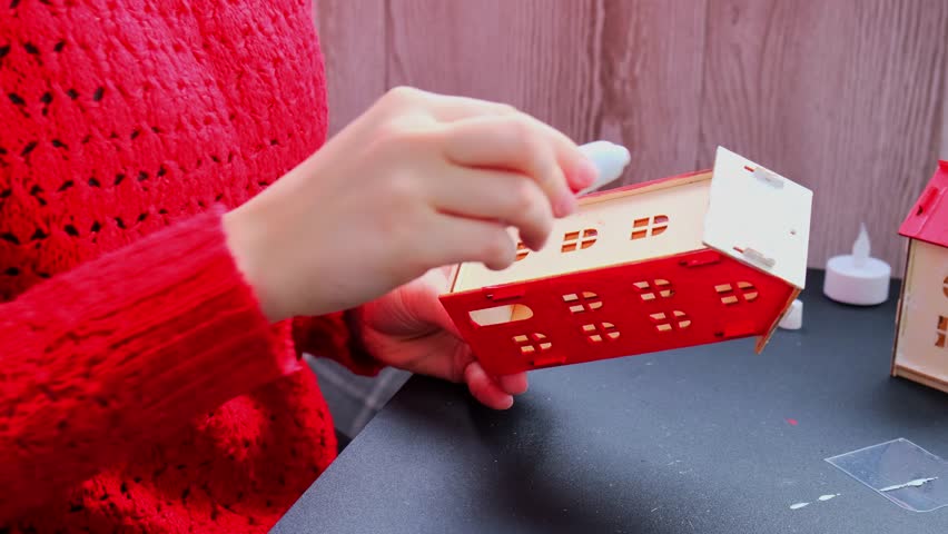 Sustainableminded Christmas cozy atmospheric festive decor in modern scandinavian home handmade decoration. Tutorial for making do it yourself craft wooden houses. Seasonal activity for kids