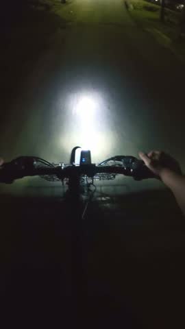 Person Riding Bicycle at Night