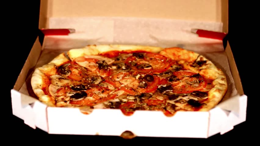 Hands Taking Slices Of Pizza. Hands taking pizza slices from wooden plate Meal time at pizzeria, man taking a slice of the pizza shot depth of field