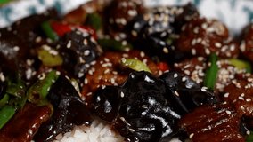 Rich stir-fry with beef slices, glossy mushrooms, green beans, red peppers, and sticky white rice. - Powered by Shutterstock - Get 15% off with code: PIKWIZARD15
