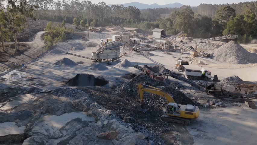 4K Drone View of Quarry with Excavator and Conveyor Belts in Forested South African Landscape