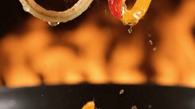  Macro close‑up of vegetables mid‑air during a wok toss with sparkling oil droplets - Powered by Shutterstock - Get 15% off with code: PIKWIZARD15