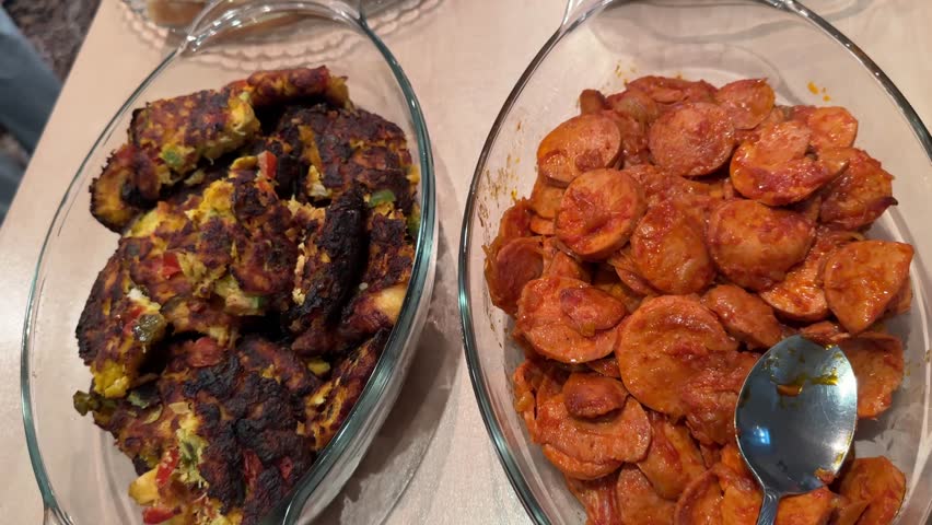 Persian party buffet grilled sausages platter kashke bademjan roasted eggplant handmade dips and healthy vegetable dishes Indoor dining for family and relatives with hot flavorful local people meals