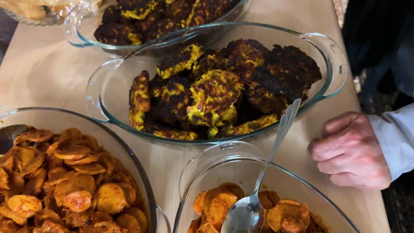 Persian party thanksgiving buffet with grilled sosis bandari adas polo sandwich cake and creamy kashke bademjan Traditional handmade dishes featuring eggplant garlic tangy yogurt and fermented dairy