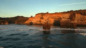 Aerial view of the rugged coastline with towering cliffs, sea stacks, and the mesmerizing ocean waves crashing against the shore, Tongaporutu, Taranaki Region, New Zealand. - Powered by Shutterstock - Get 15% off with code: PIKWIZARD15