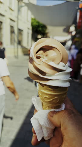 Holding a Delicious Ice Cream Cone on a Crowded Street