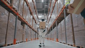 Autonomous robot transporting cardboard box down warehouse aisle while two female staff members scanning inventory. Collaborating with human team during fast distribution workflow. - Powered by Shutterstock - Get 15% off with code: PIKWIZARD15