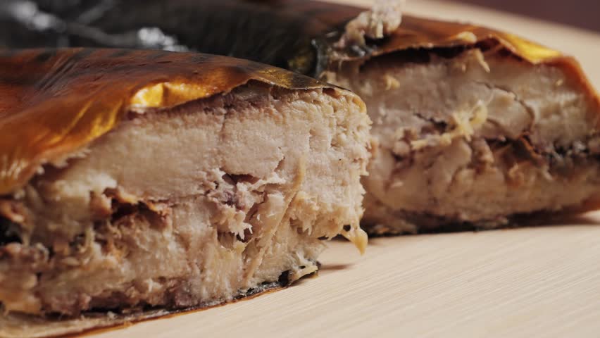 Smoked Atlantic Mackerel Cut Into Pieces, Delicious Smoked Mackerel Meat. Hot Smoked Fish Texture. High quality 4k footage