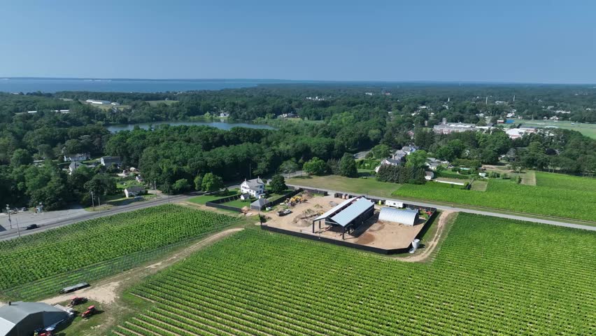 drone flying over farmland in long island by the vineyards.