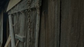 A detailed close-up shot of an old weathered wooden shed wall evokes a rustic, abandoned, and nostalgic atmosphere - Powered by Shutterstock - Get 15% off with code: PIKWIZARD15