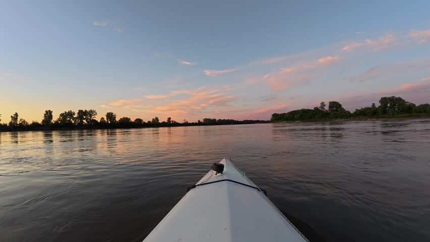 POV from kayak or canoe - sunset paddling on the Missouri River between Waverly and Miami, MO