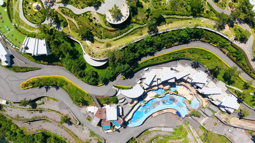Aerial view of Yeosu Art Land in Dolsan, South Korea, featuring a Ferris wheel, resorts, and scenic southern coast