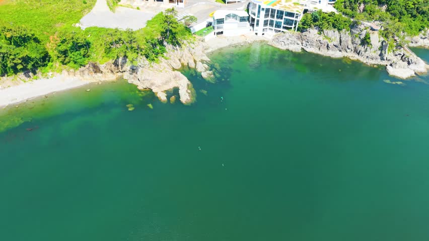 Aerial view of Yeosu Art Land in Dolsan, South Korea, featuring a Ferris wheel, resorts, and scenic southern coast
