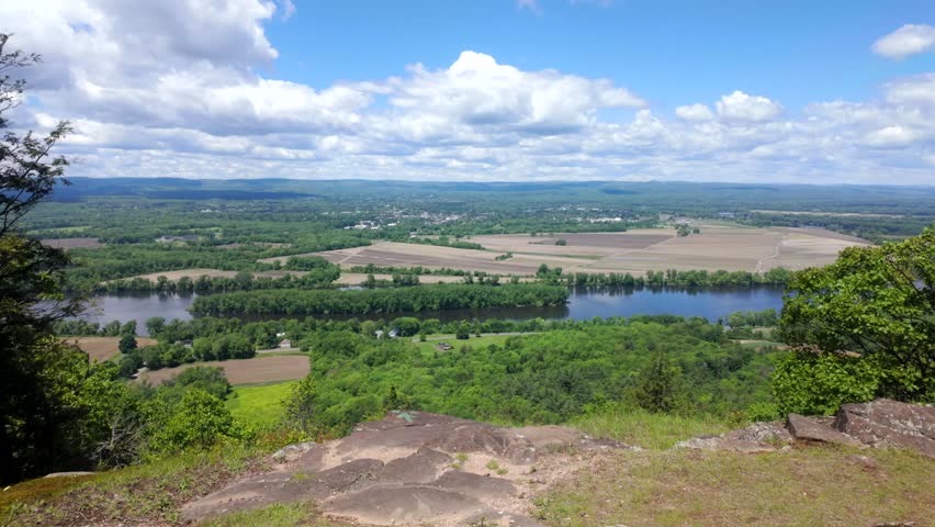 Aerial establishing shot over Northampton and Connecticut River, summer view