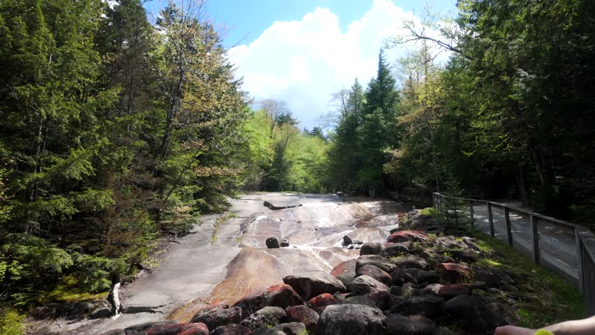 Establishing wide of table rock waterfall in Flume Gorge New Hampshire