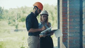 Engineers At Construction Site. Two Architects Discussing Project Plans. Professional Teamwork On Building Project. Wearing Hard Hats And Looking At Blueprints. Real Estate Development. Civil Engineer - Powered by Shutterstock - Get 15% off with code: PIKWIZARD15