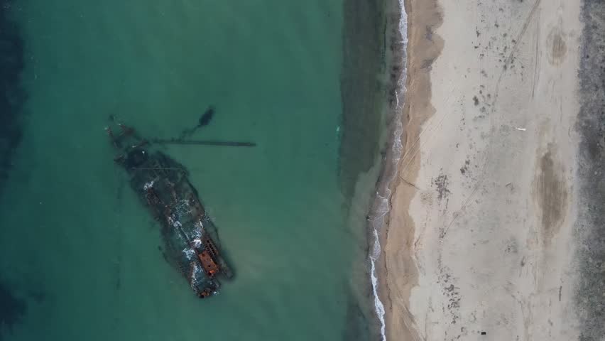 Aerial top down of wrecked boat Mediterranean Sea view from shipwreck near Thessaloniki Greece
