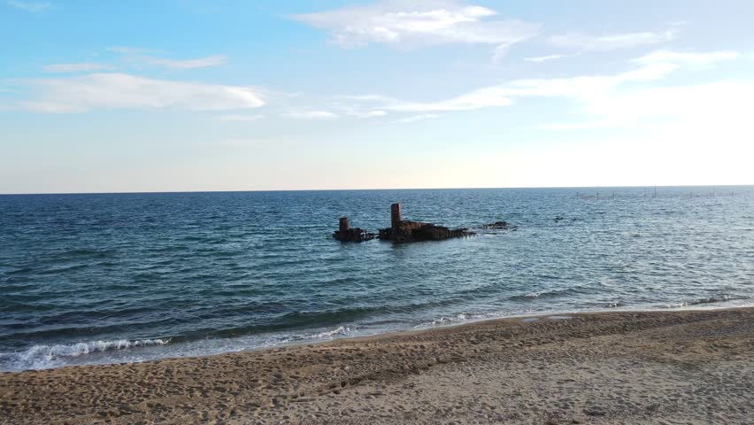 Aerial landscape of wrecked boat Mediterranean Sea view from shipwreck near Thessaloniki Greece