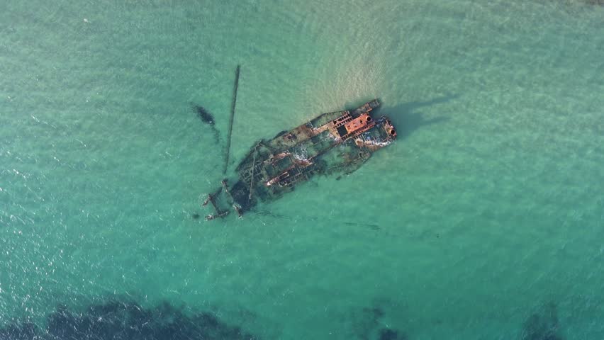 Aerial top down of wrecked boat Mediterranean Sea view from shipwreck near Thessaloniki Greece