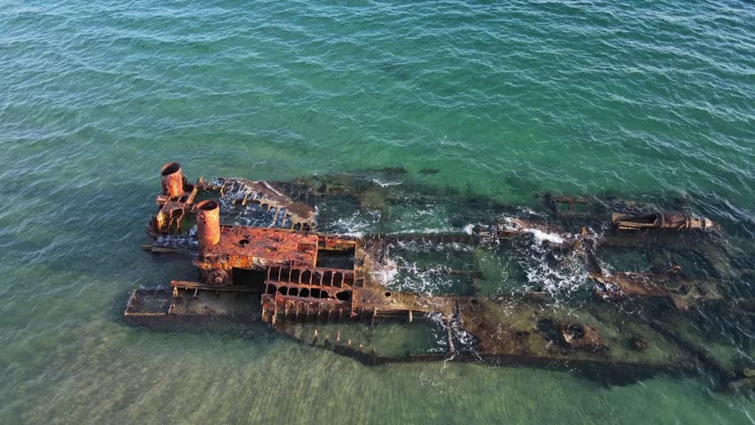 Aerial top down of wrecked boat Mediterranean Sea view from shipwreck near Thessaloniki Greece