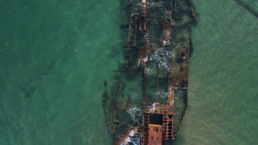Aerial top down of wrecked boat Mediterranean Sea view from shipwreck near Thessaloniki Greece