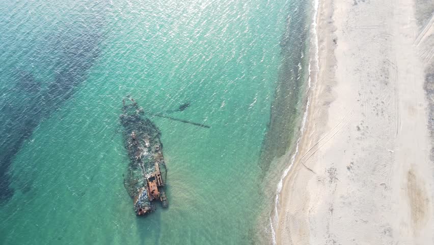 Aerial top down of wrecked boat Mediterranean Sea view from shipwreck near Thessaloniki Greece