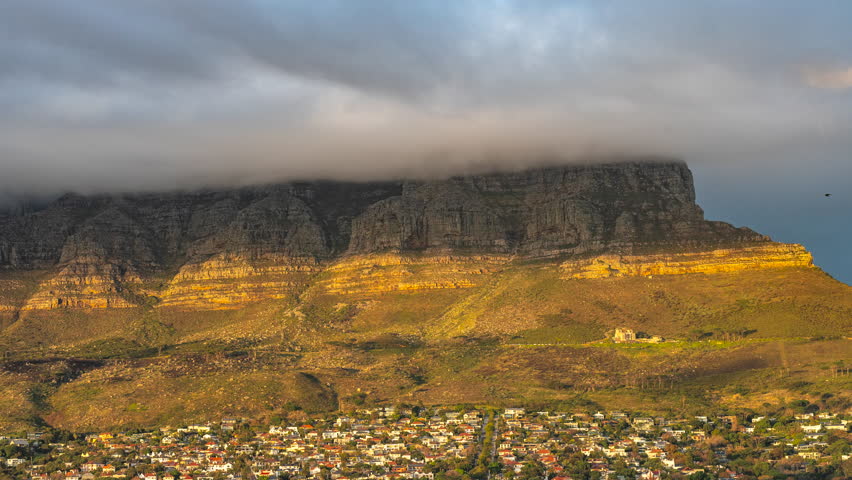 Table Mountain Shrouded In Clouds Over Cape Town City In South Africa. - timelapse shot