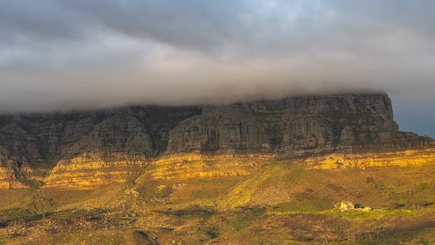 Thick Clouds Over Cape Town City Passing By Iconic Table Mountain In South Africa. - timelapse, zoom out