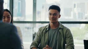 Businessmen shaking hands with diverse colleagues applauding sitting at conference table in office - Powered by Shutterstock - Get 15% off with code: PIKWIZARD15
